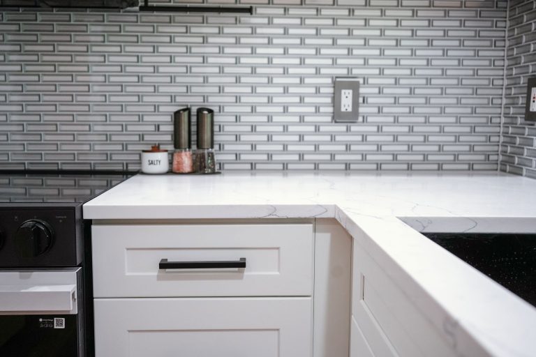 dove white shaker cabinets close up black handles
