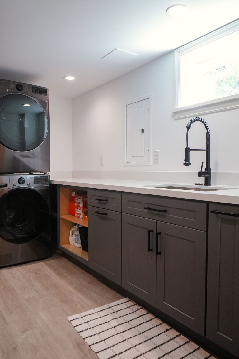 laundry room with dark gray shaker cabinets