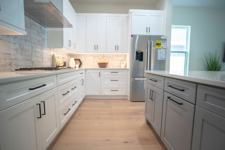 modern white shaker kitchen cabinets with brushed steel handles