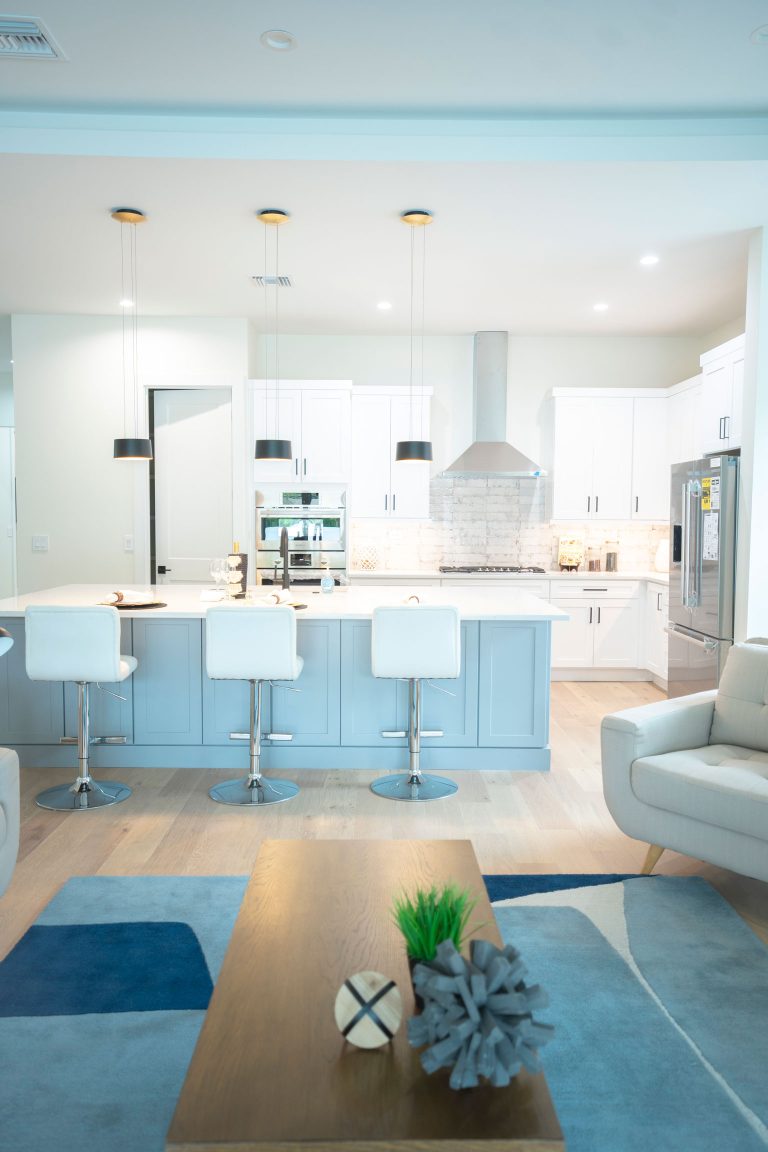 white shaker cabinets gray island pendant lights