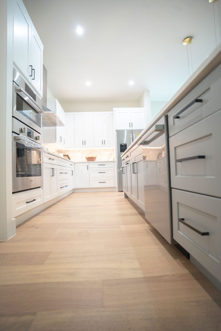 white shaker cabinets light wood flooring 1